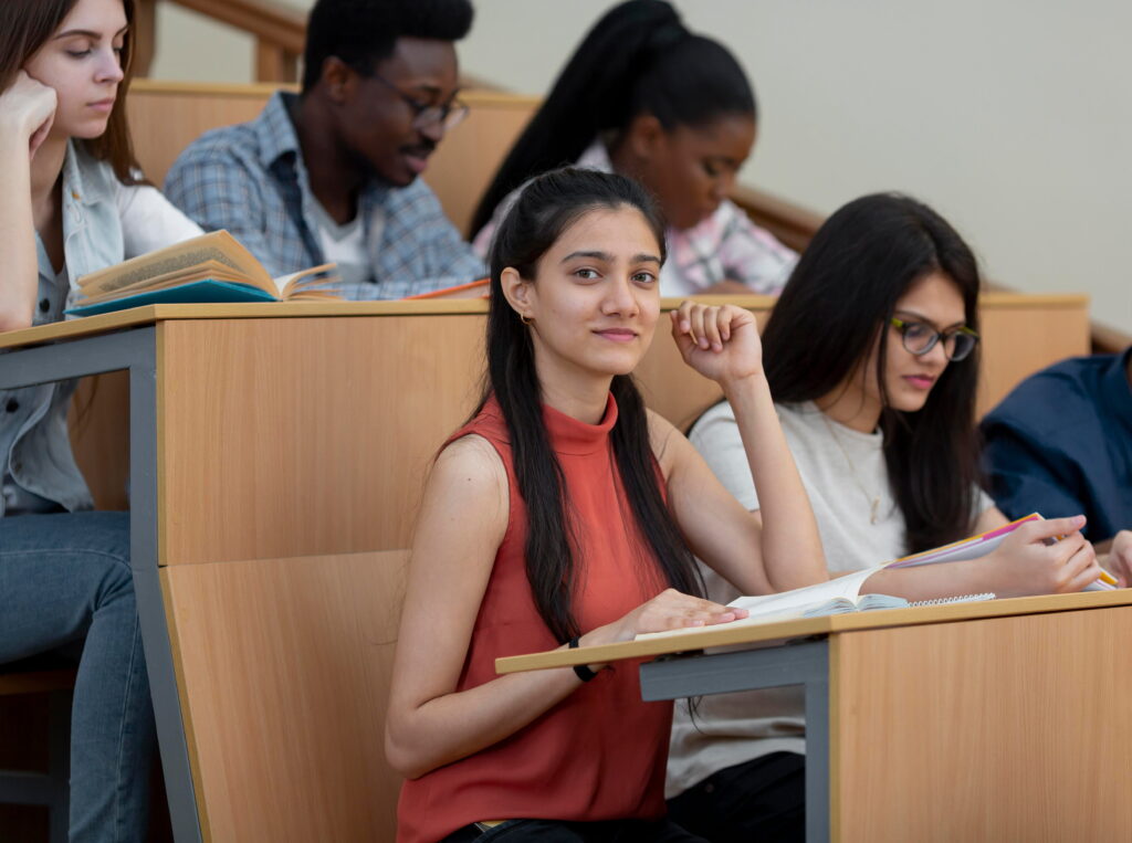 STUDENT SITTING ON CLASSROOM 
