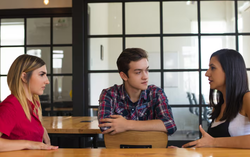 a group of people discuss in english