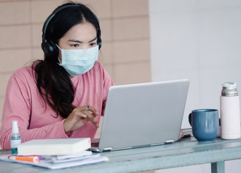 a woman attending speaking fever  classes during Covid 